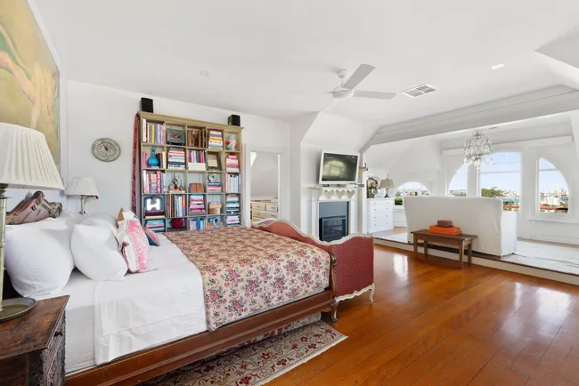 A large main bedroom with an adjoining sun room