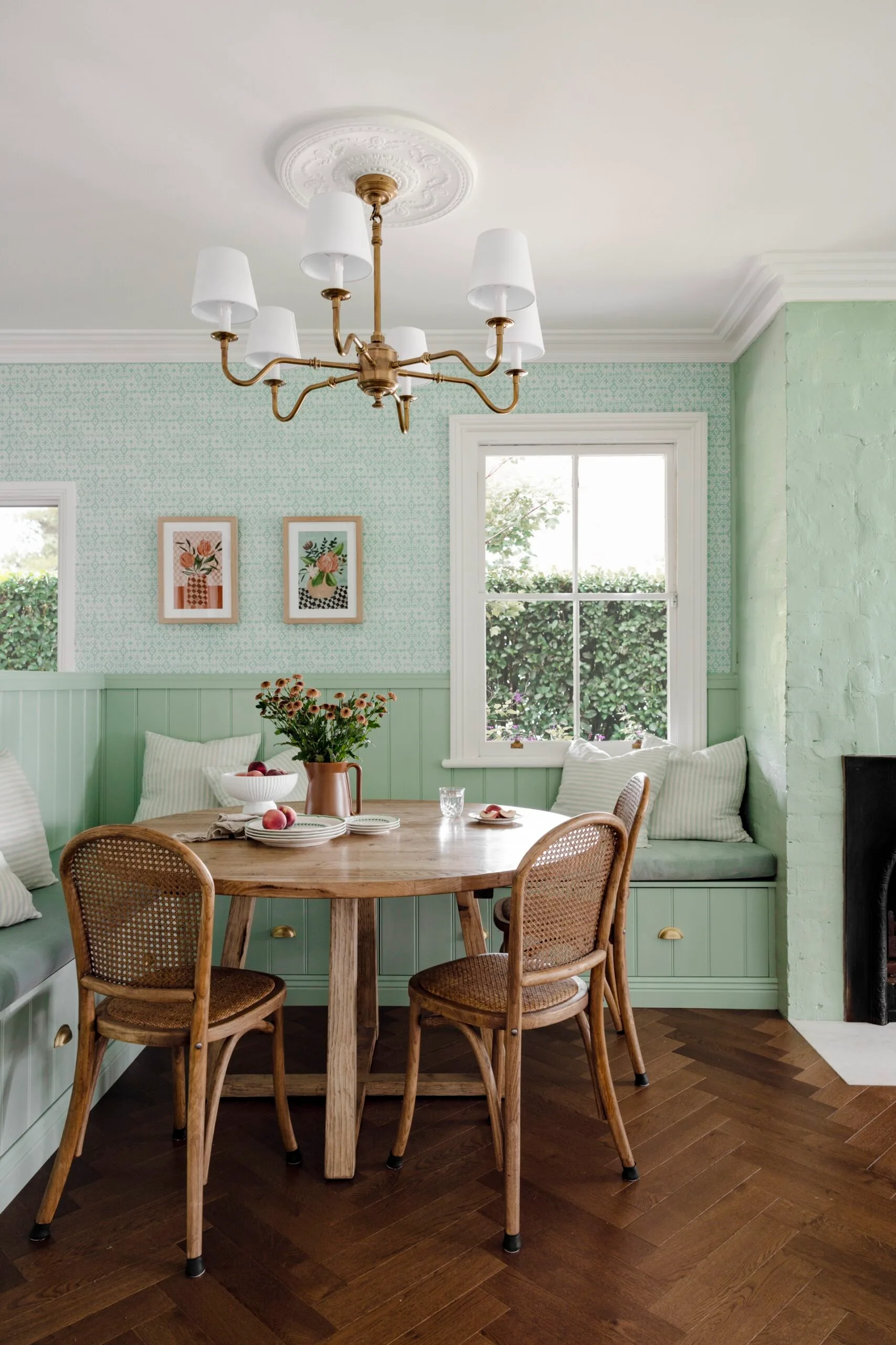 A green country dining room with herringbone flooring