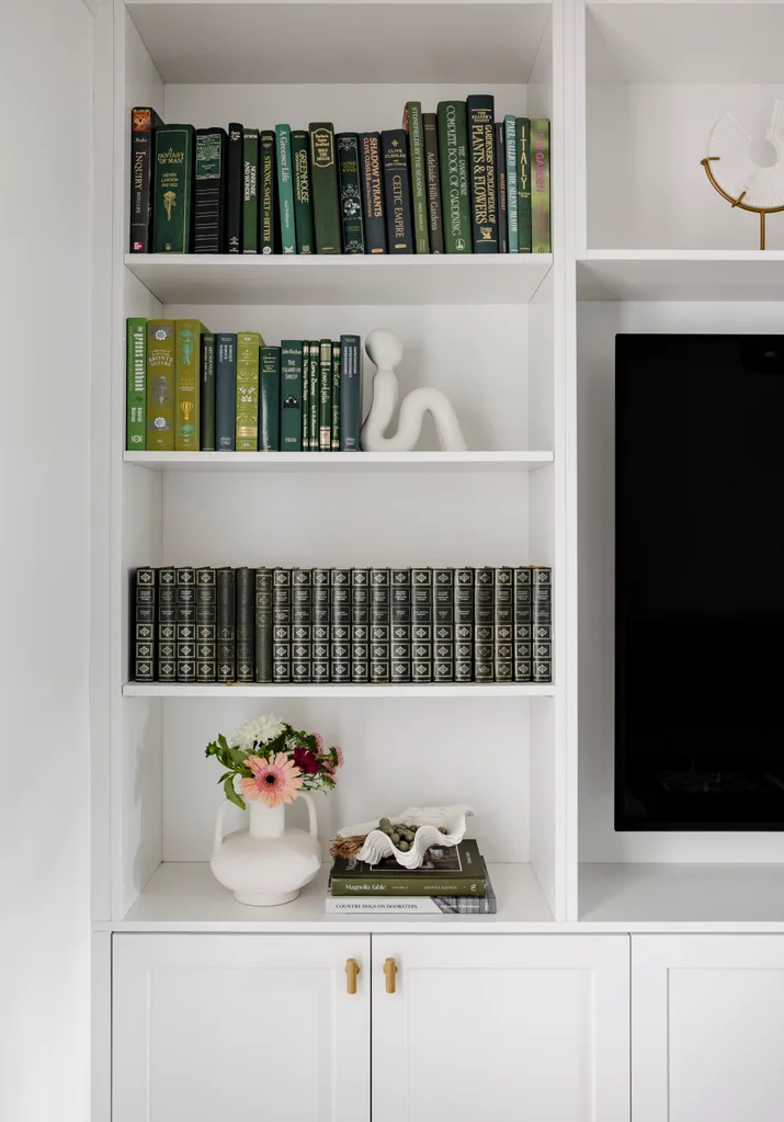 A library with green books.