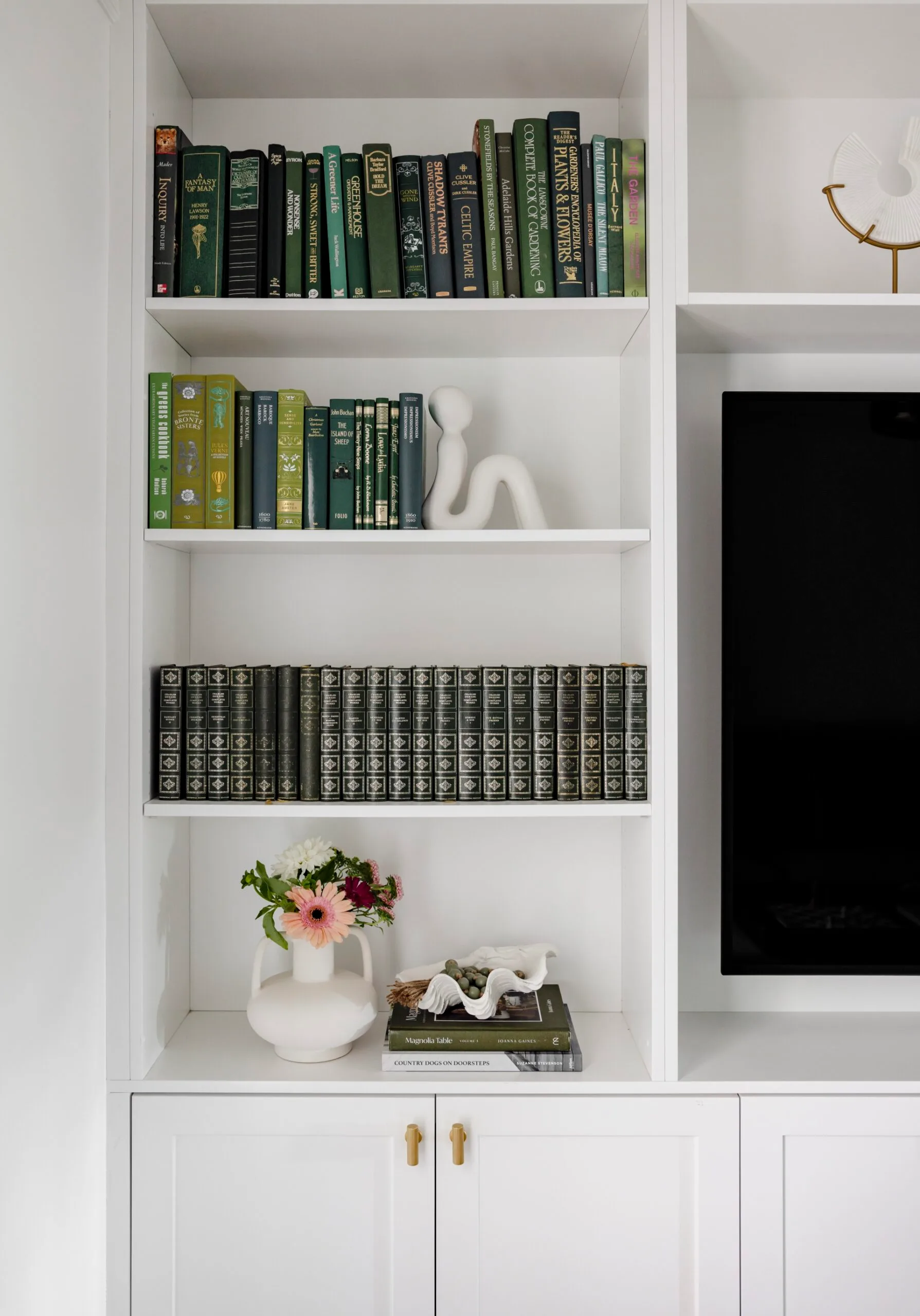 A library with green books.