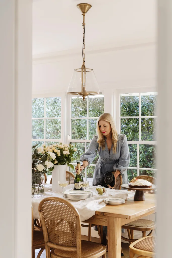 Natalie Hazel’s dining room with cake and fresh flowers