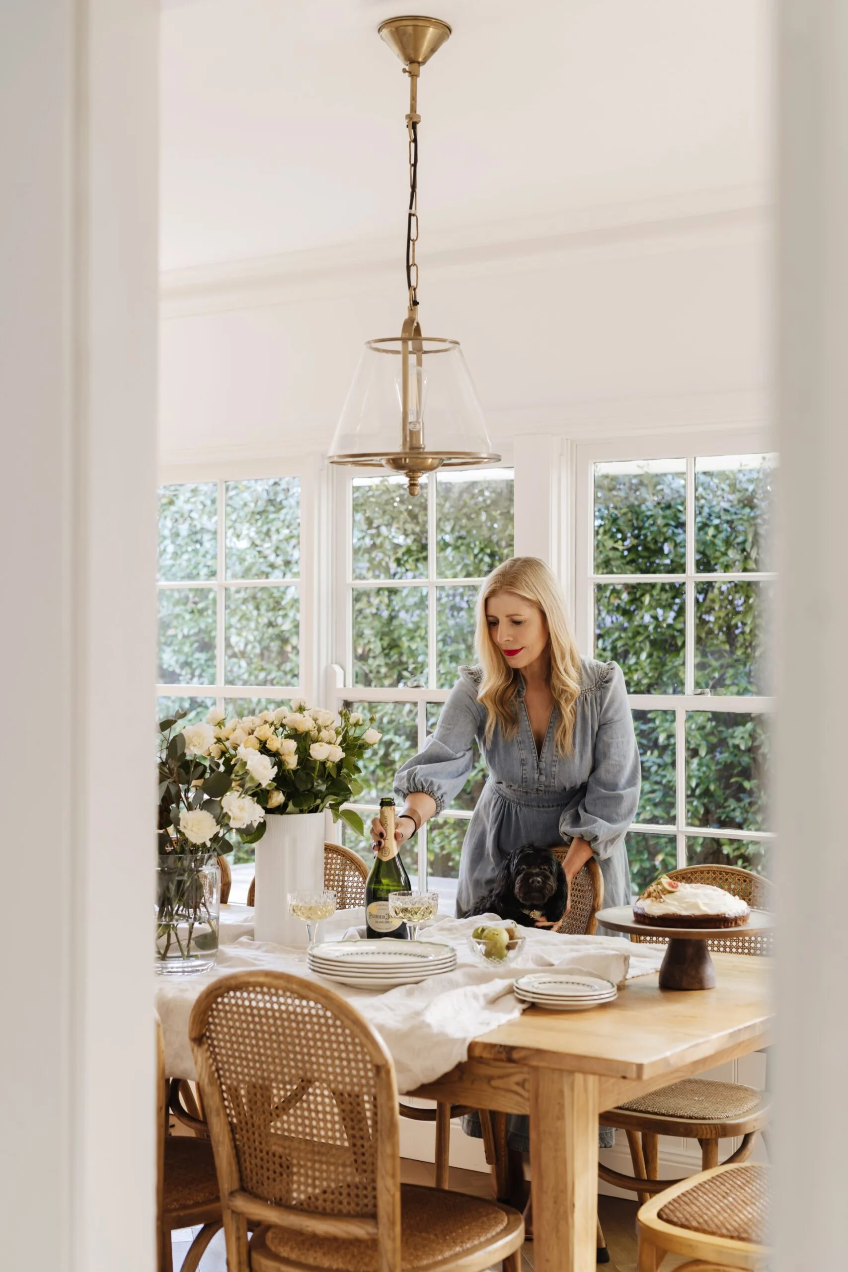 Natalie Hazel&rsquo;s dining room with cake and fresh flowers