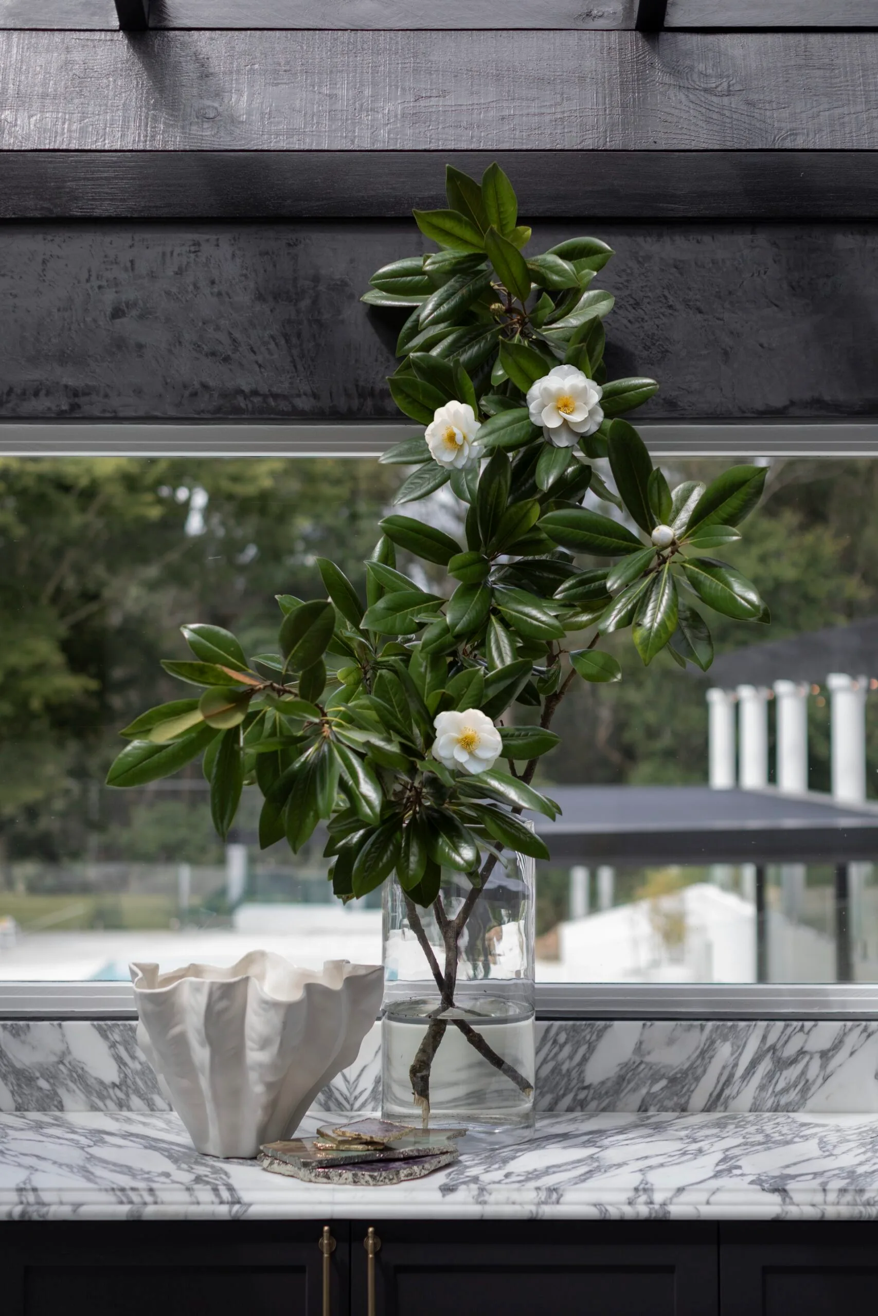 A floral arrangement on a marble countertop