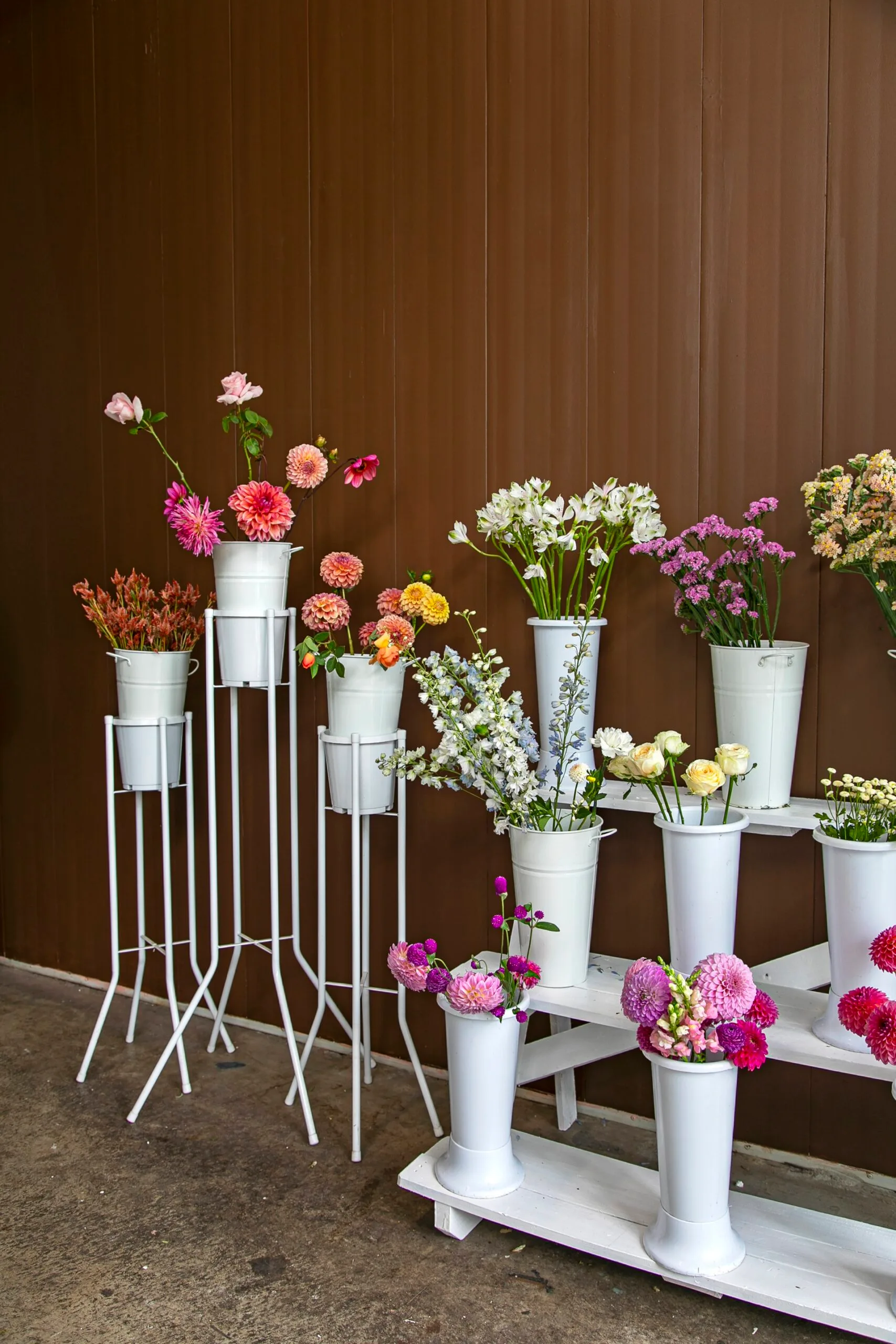 Cut flowers in vases ready to be made into bouquets.