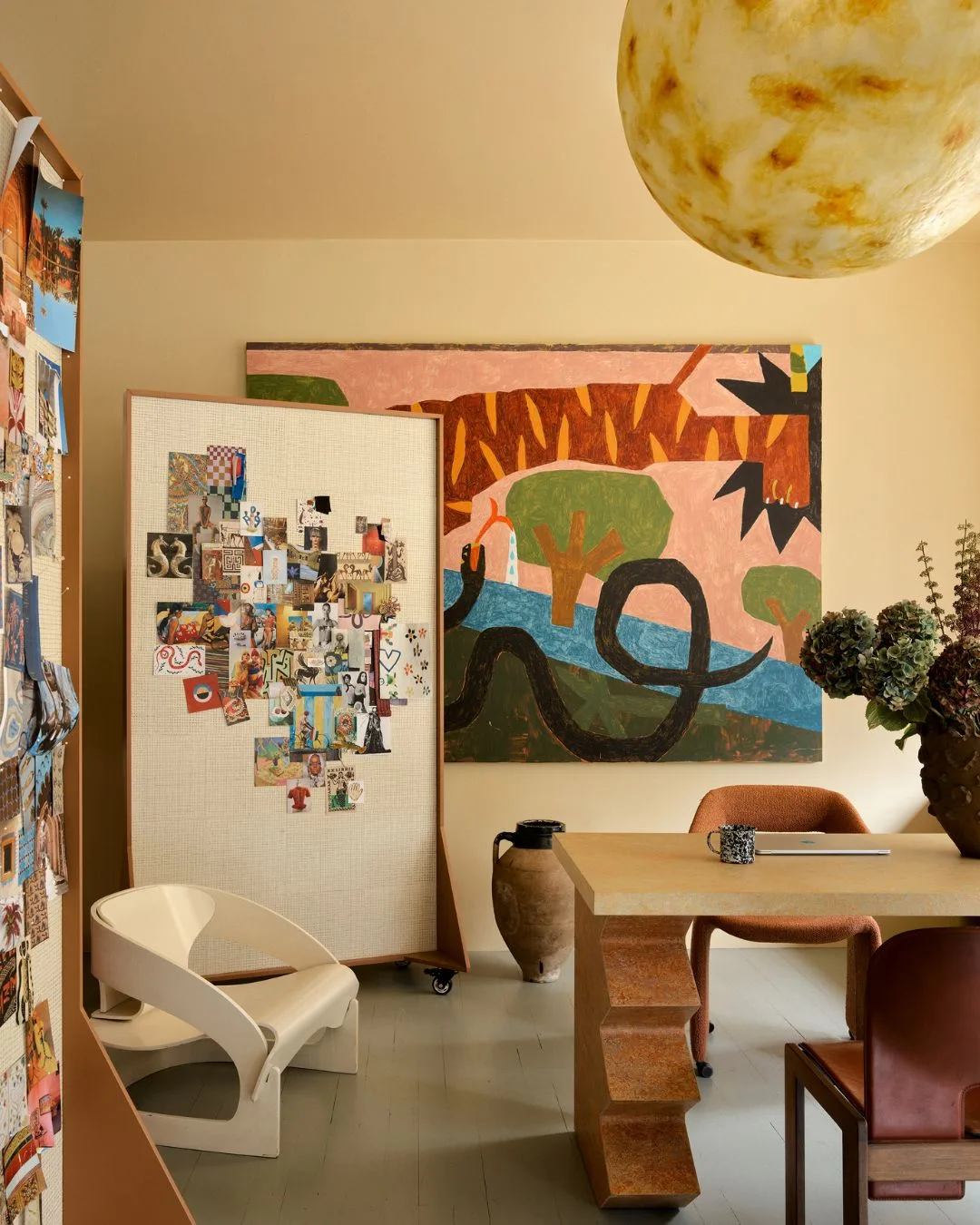 A vibrant artwork by Cannon Dill titled Tiger and Snake in the Garden fills the wall in Chris&rsquo;s office at the Alemais Sydney offices. 