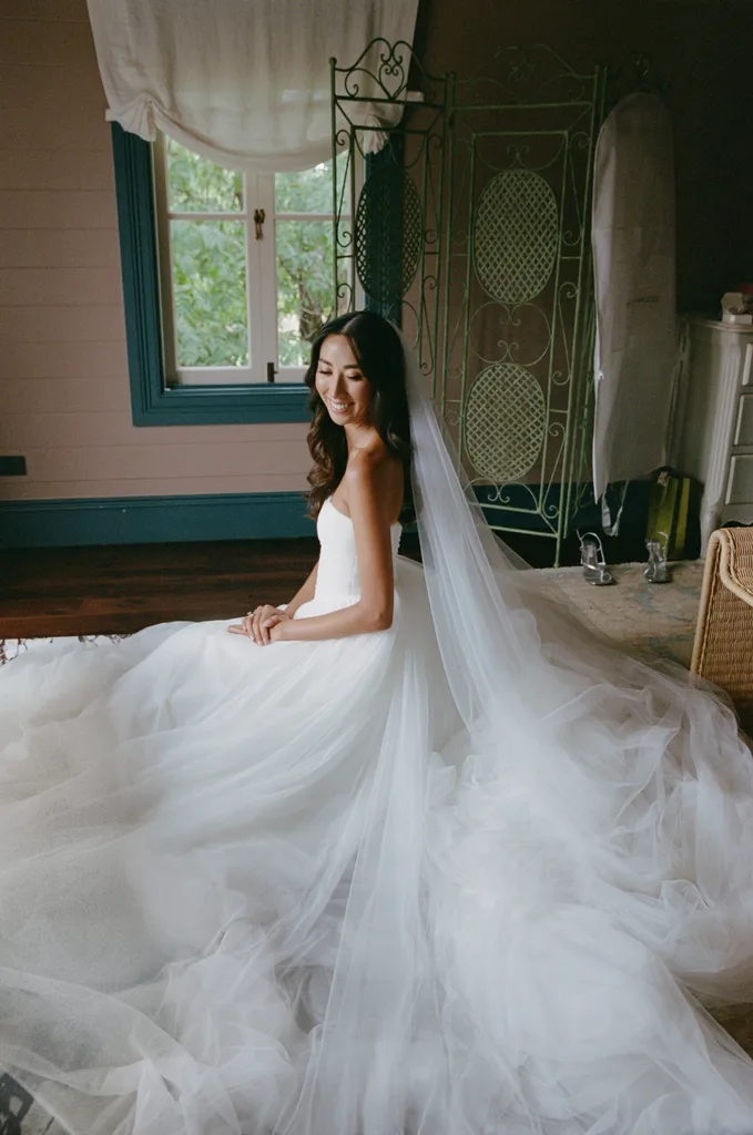 A bride in a white dress and veil