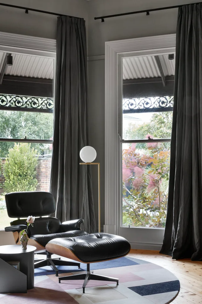 Herman Miller chair in study with large windows. Belle