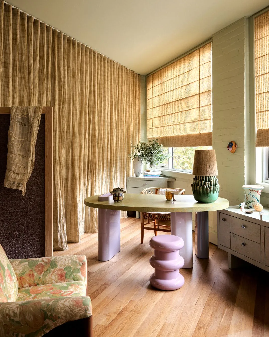 Alemais Sydney office YSG Studio design with a green and lilac desk that sits in the corner in front of windows. 