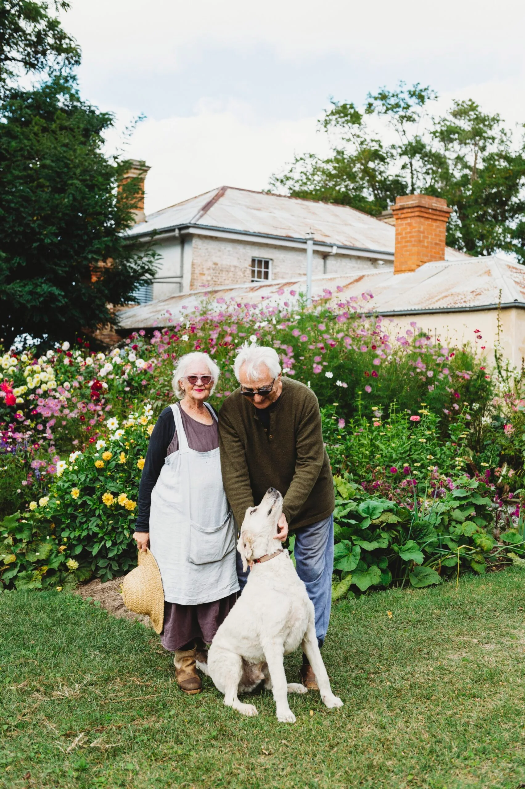 Owners Suzy and Richard with their retriever Billy outside their heritage home, Rainham