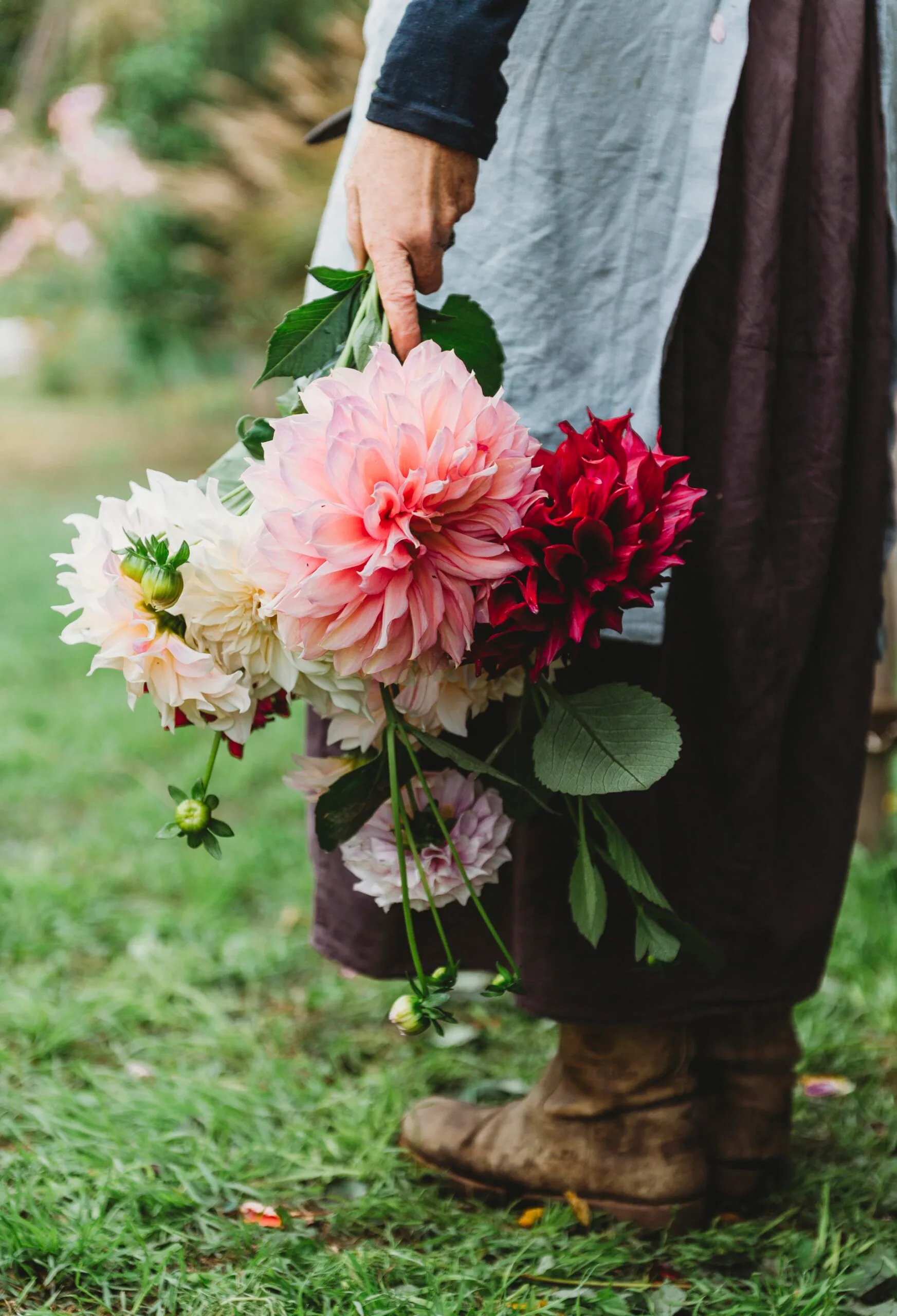 Suzy holding a bunch of pink flowers
