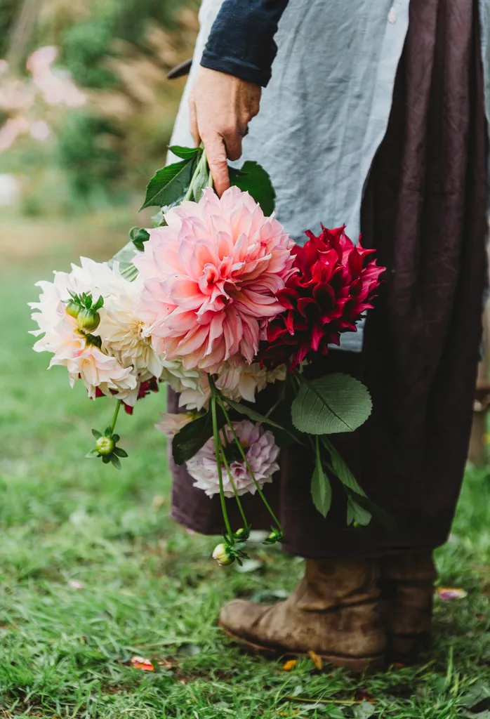 Suzy holding a bunch of pink flowers