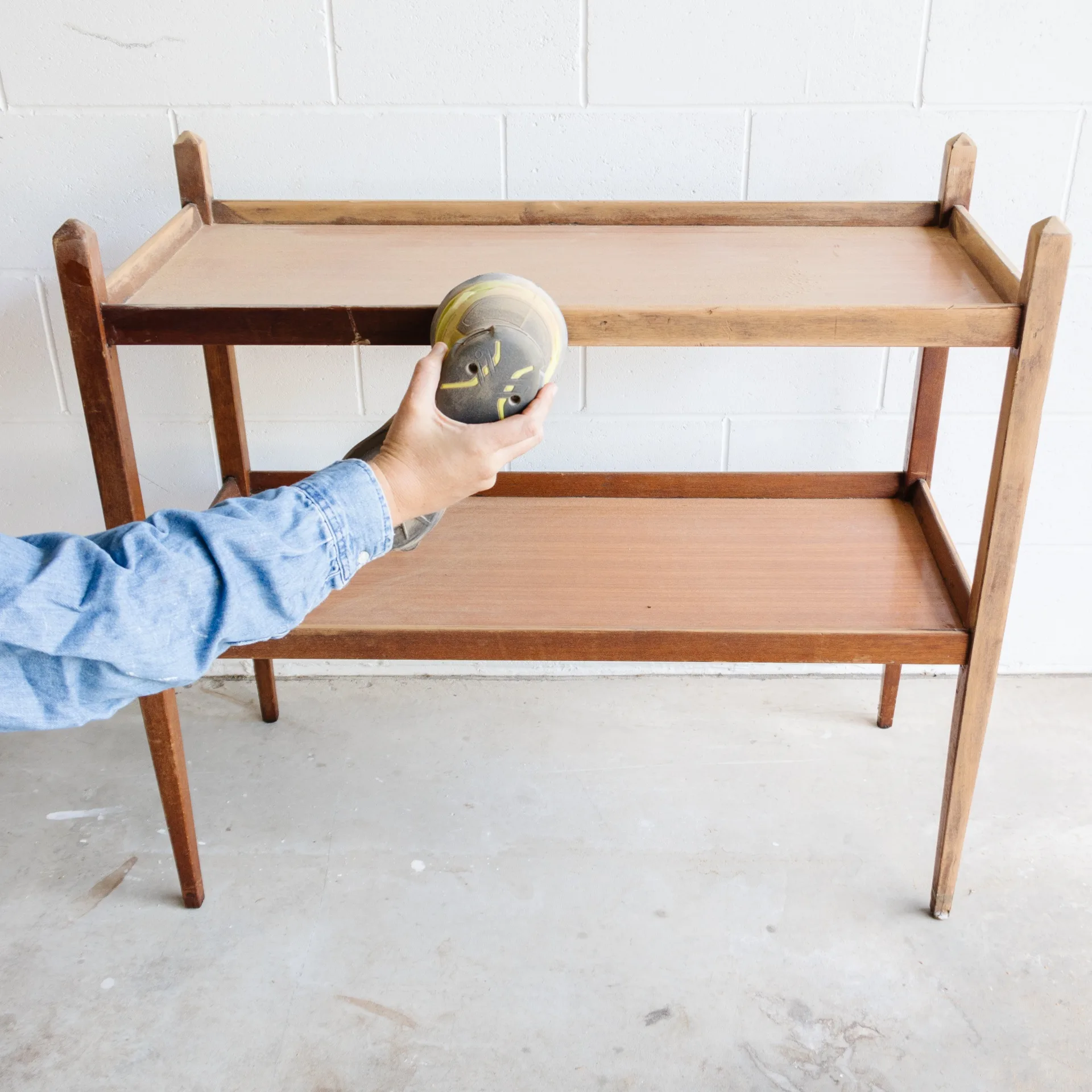 Sanding a table ready for a DIY project