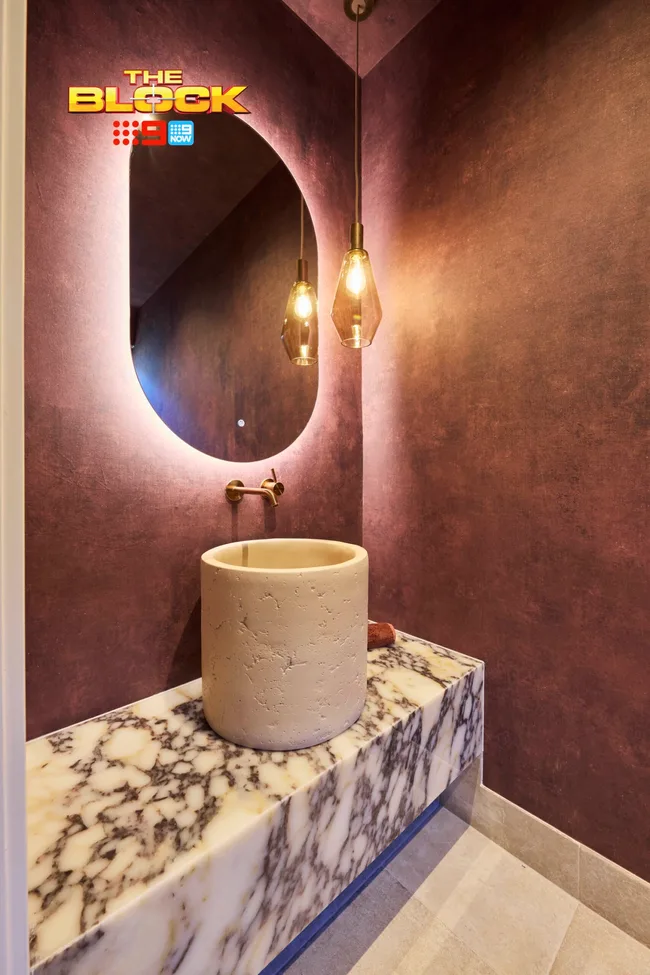Sonny and Alicia's burgundy powder room