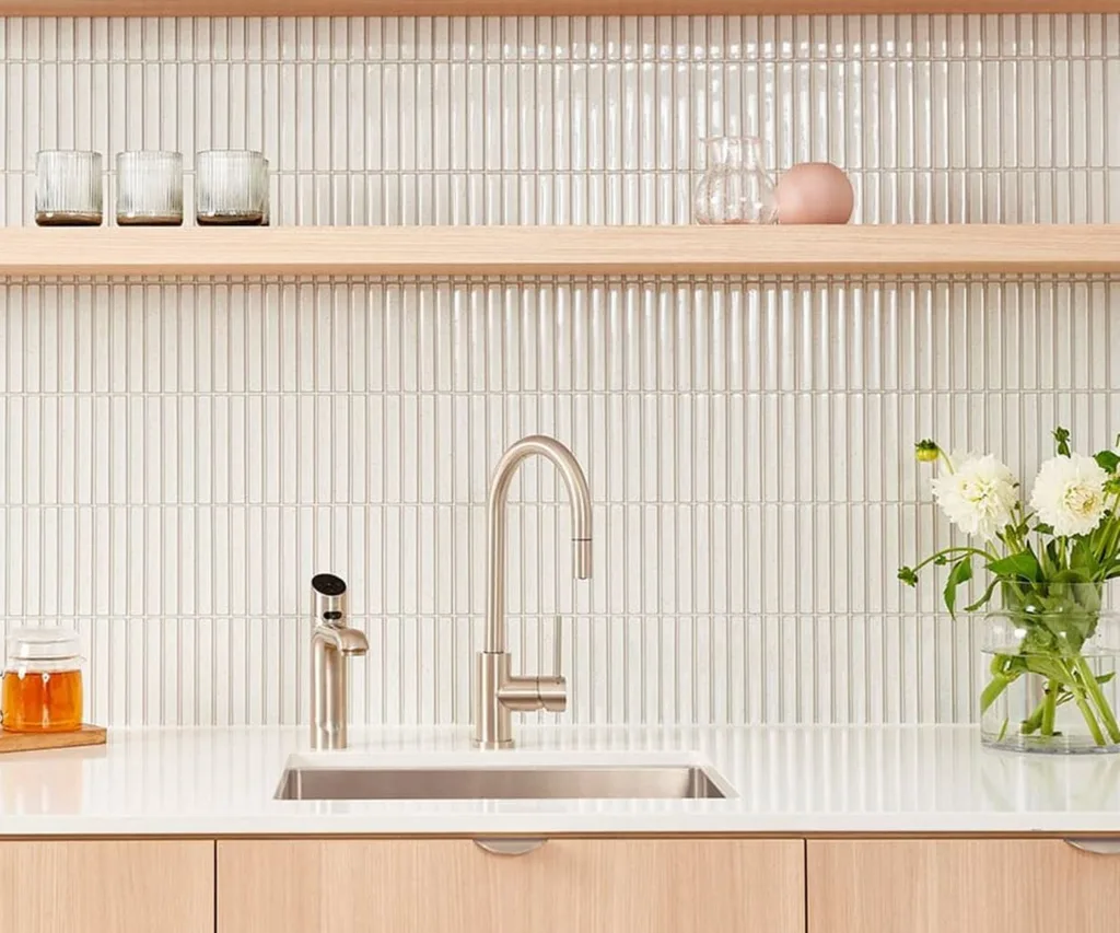 Kitchen bench with sink and silver ZIP tap, white tiles