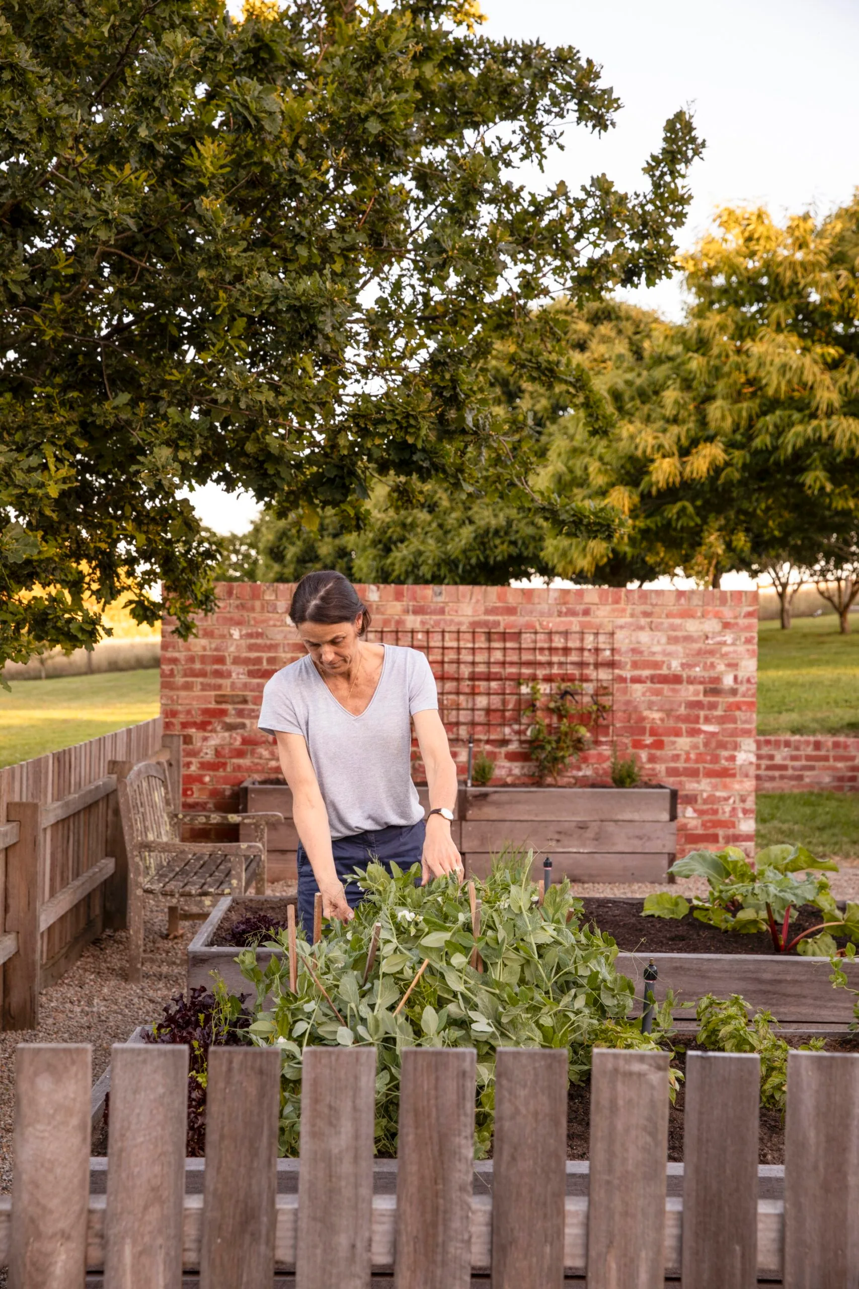 Homeowner Pip tending to her vegie garden