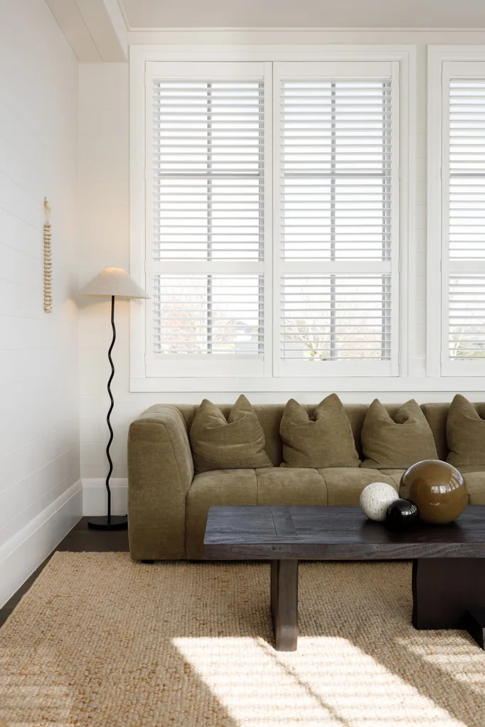 Modern green couch and wiggle lamp