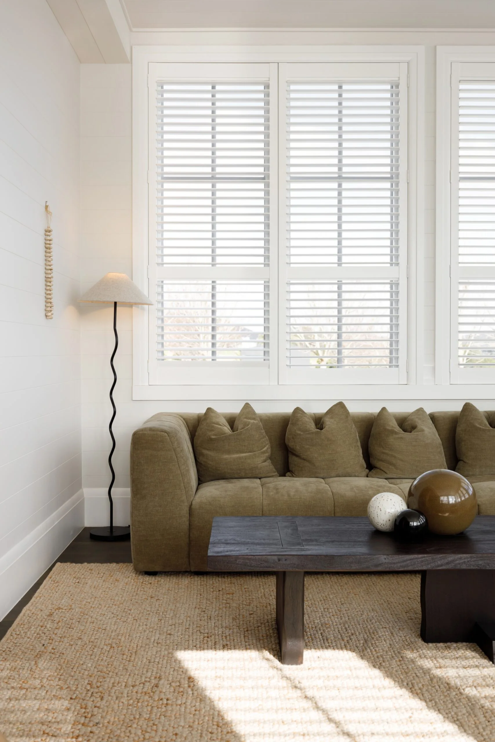 Modern green couch and wiggle lamp