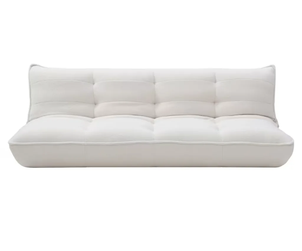A white boucle slouch couch