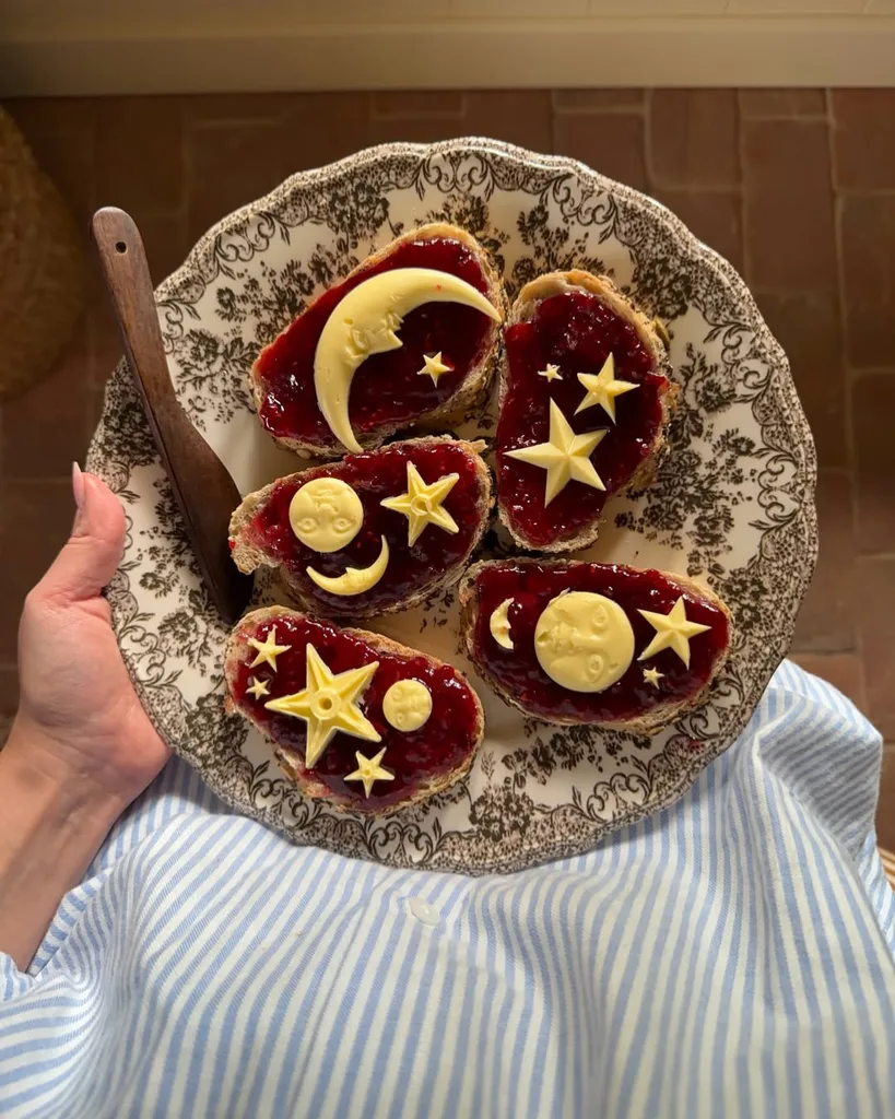 A pattern plate with toast, jam and butter shaped in moons and stars