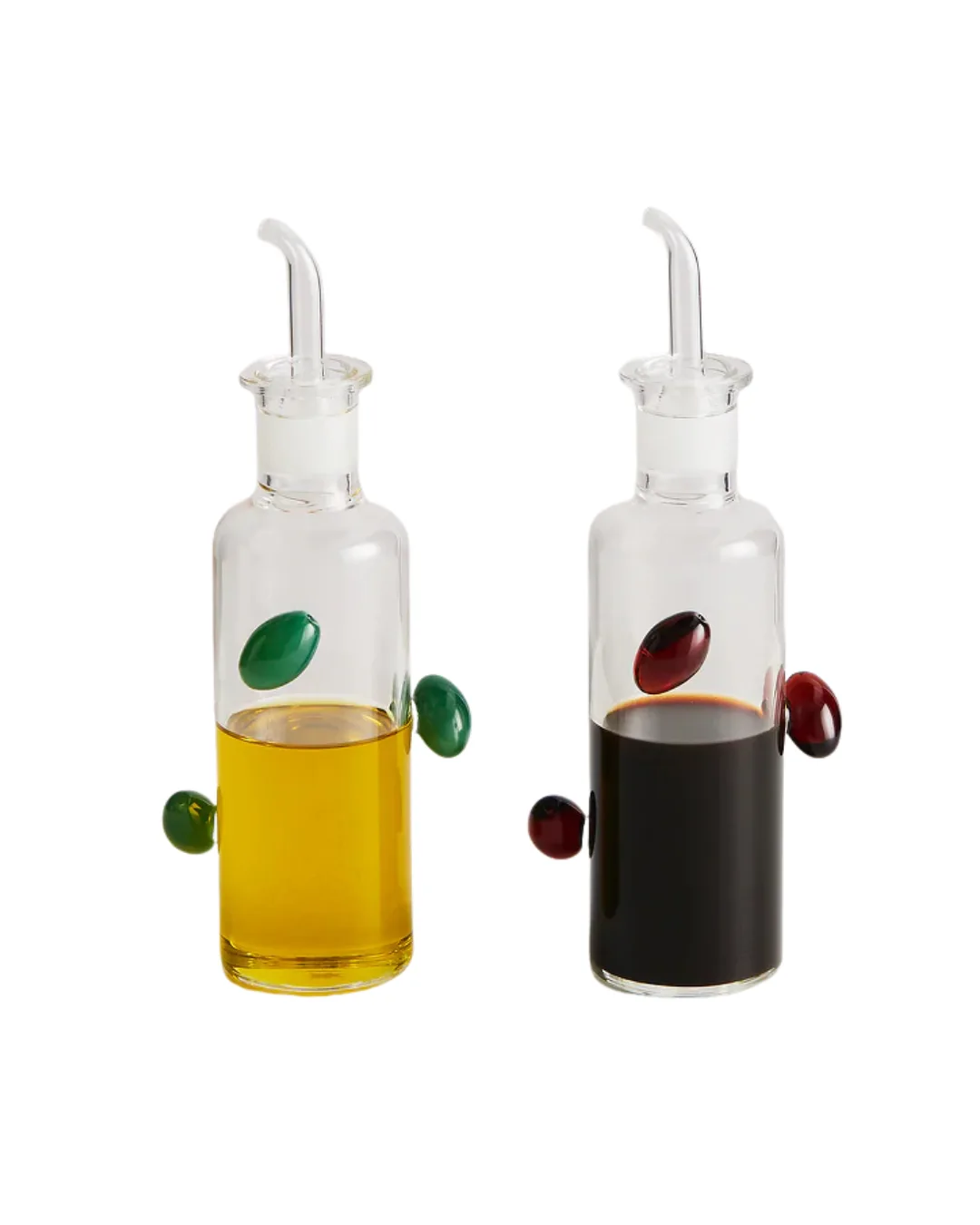 two olive oil bottles with ceramic olives attached to the surface