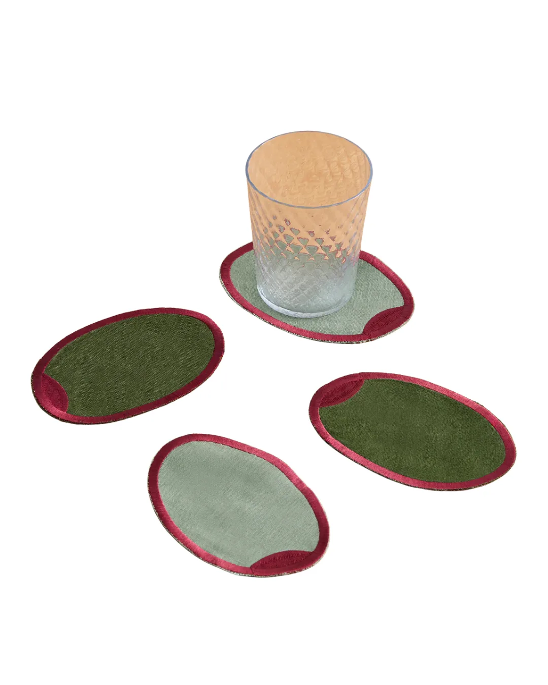4 green coasters with red embroidery designed to look like olives 