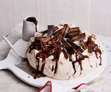 A dark Tim Tam pavlova
