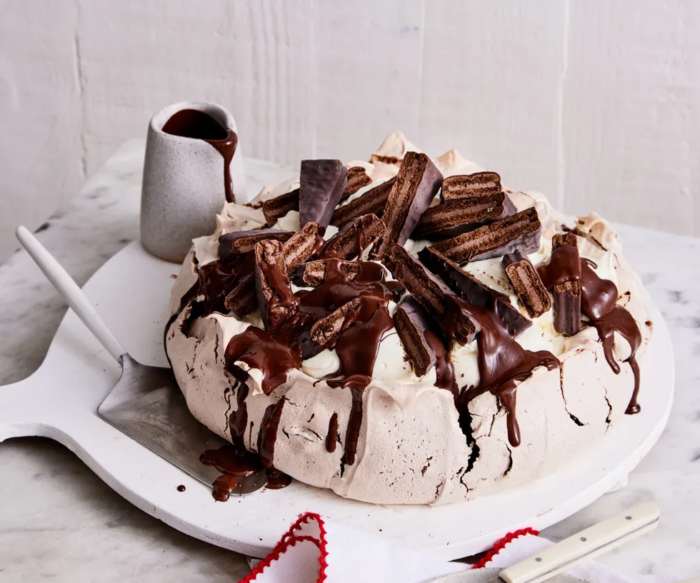 A dark Tim Tam pavlova