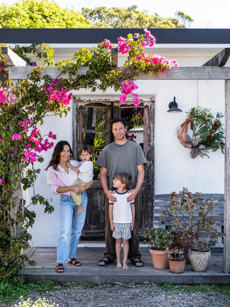 A family outside their Spanish-inspired beach house