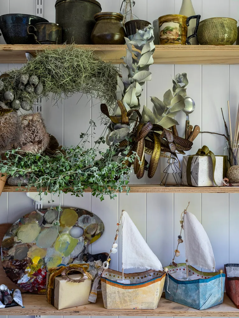 a native wreath and papier-mâché sailing ships