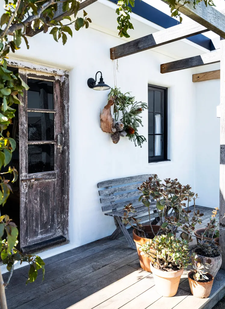 A salvaged door leads out to a deck.