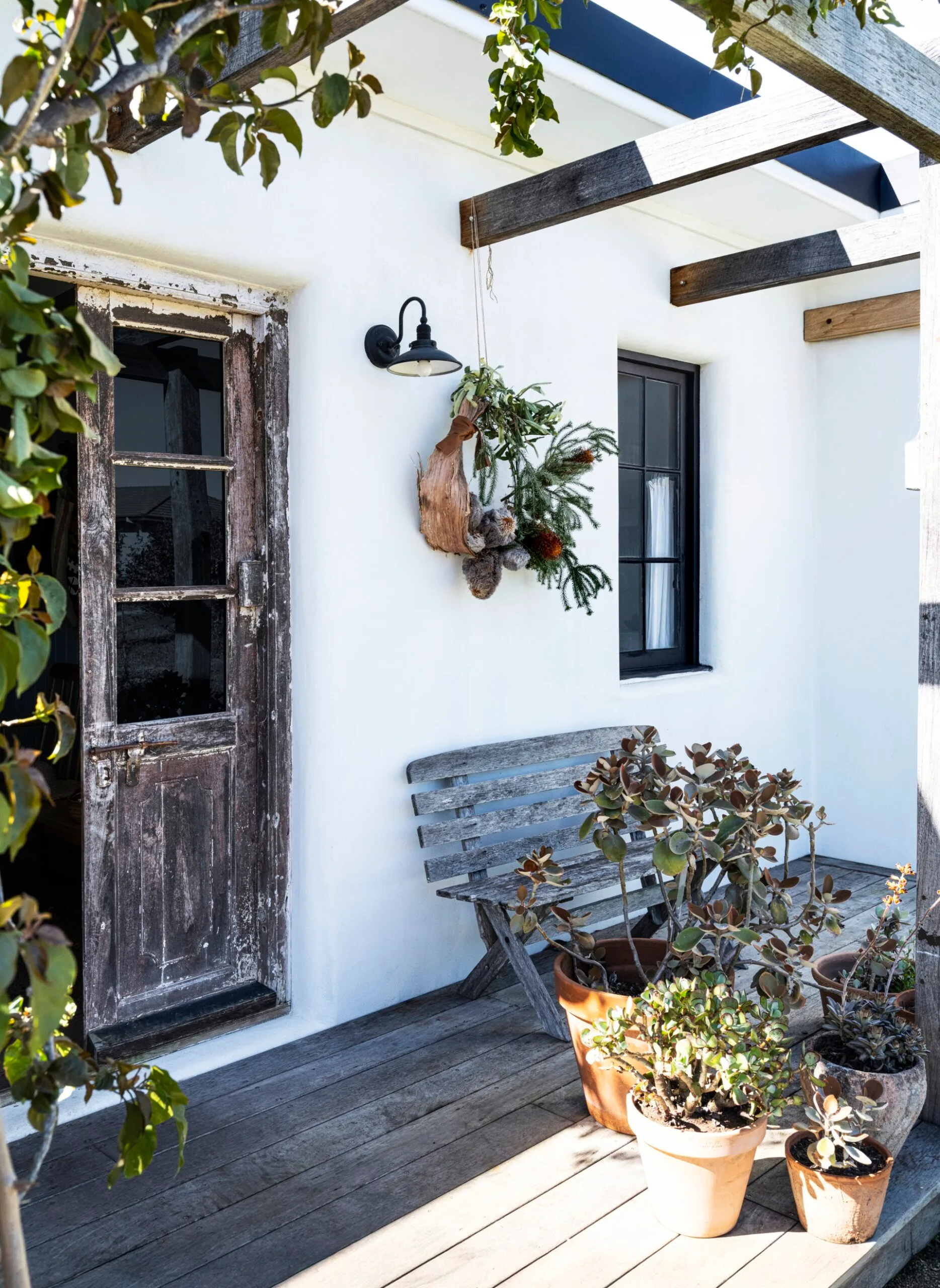 A salvaged door leads out to a deck.