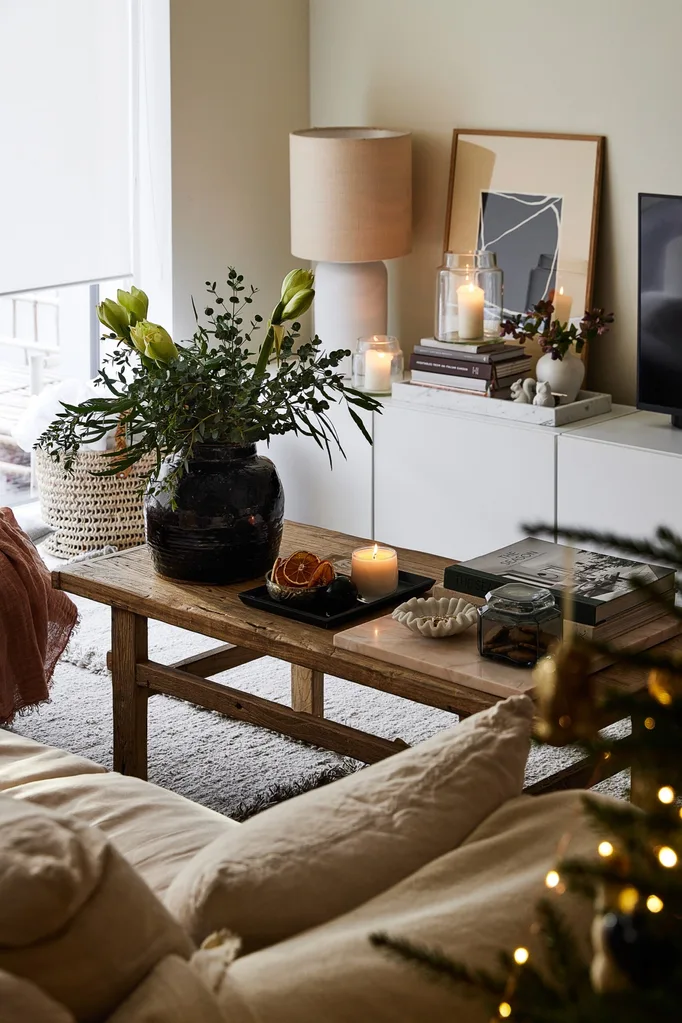 A festively decorated lounge room with a timber coffee table