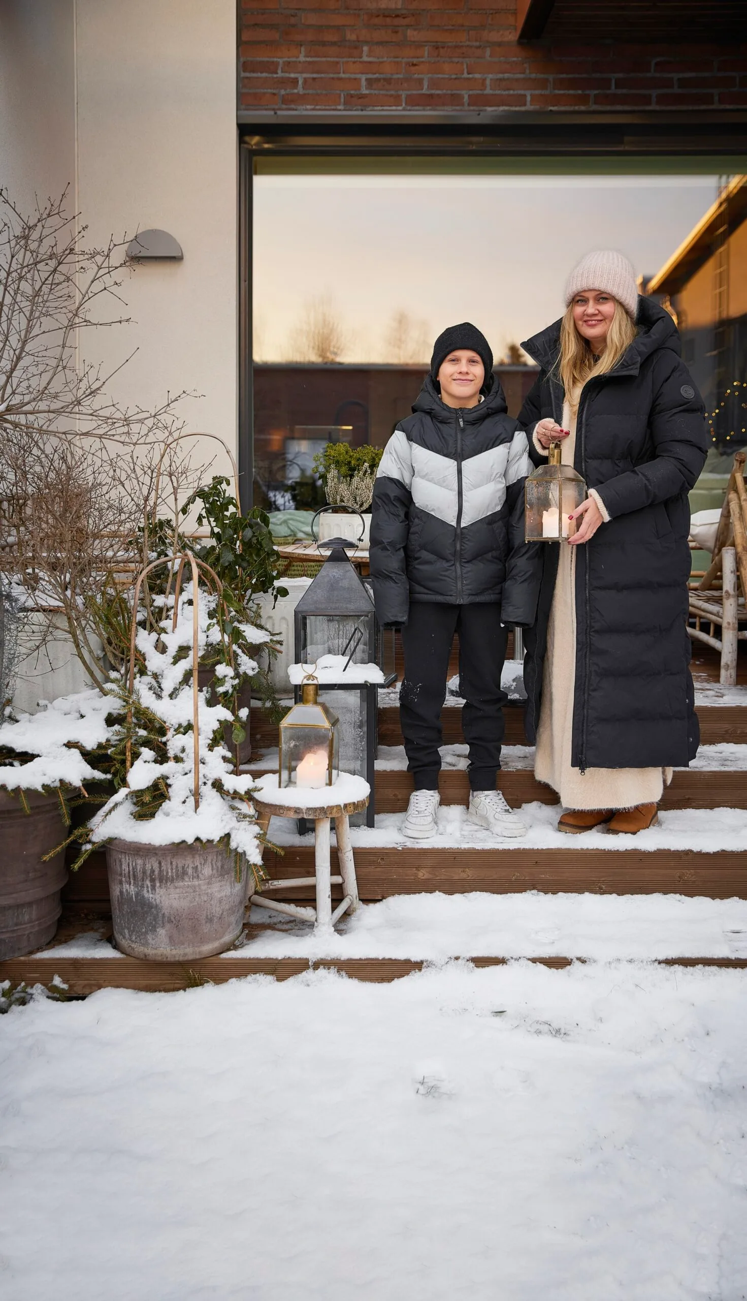 Sanna and her son stood on their snow-covered porch in Finland