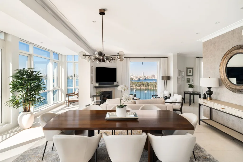 A white contemporary living and dining area of a Mosman penthouse