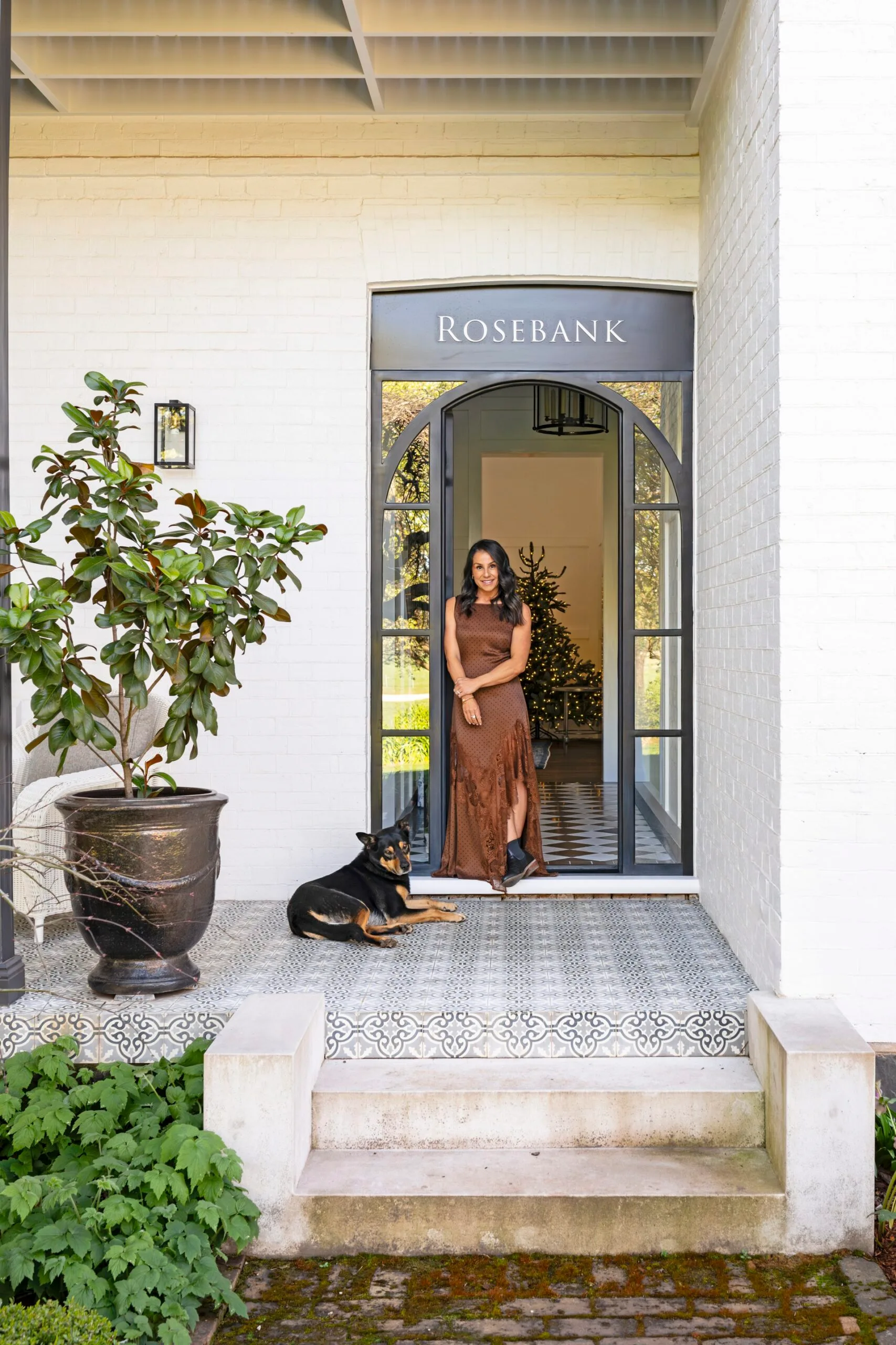 Maree standing at the doorstep of her home known as Rosebank