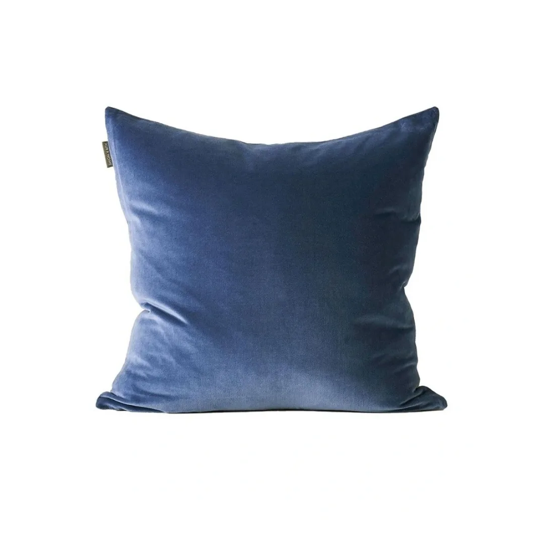 a blue velvet cushion