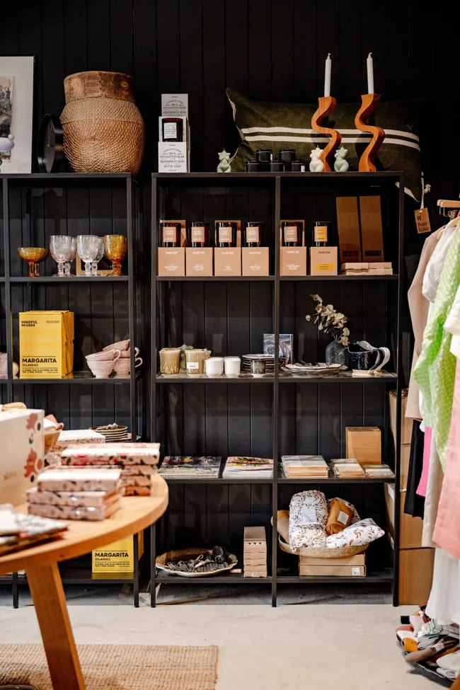 Black shelving units full of local products in The General Kinsfolk