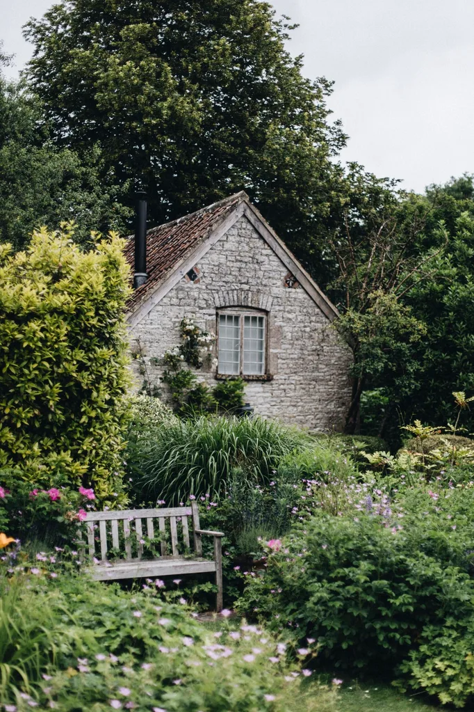 A garden beside a stone building