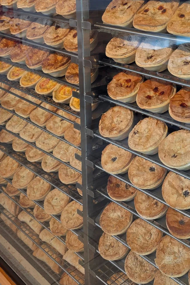 Rows of trays filled with pies