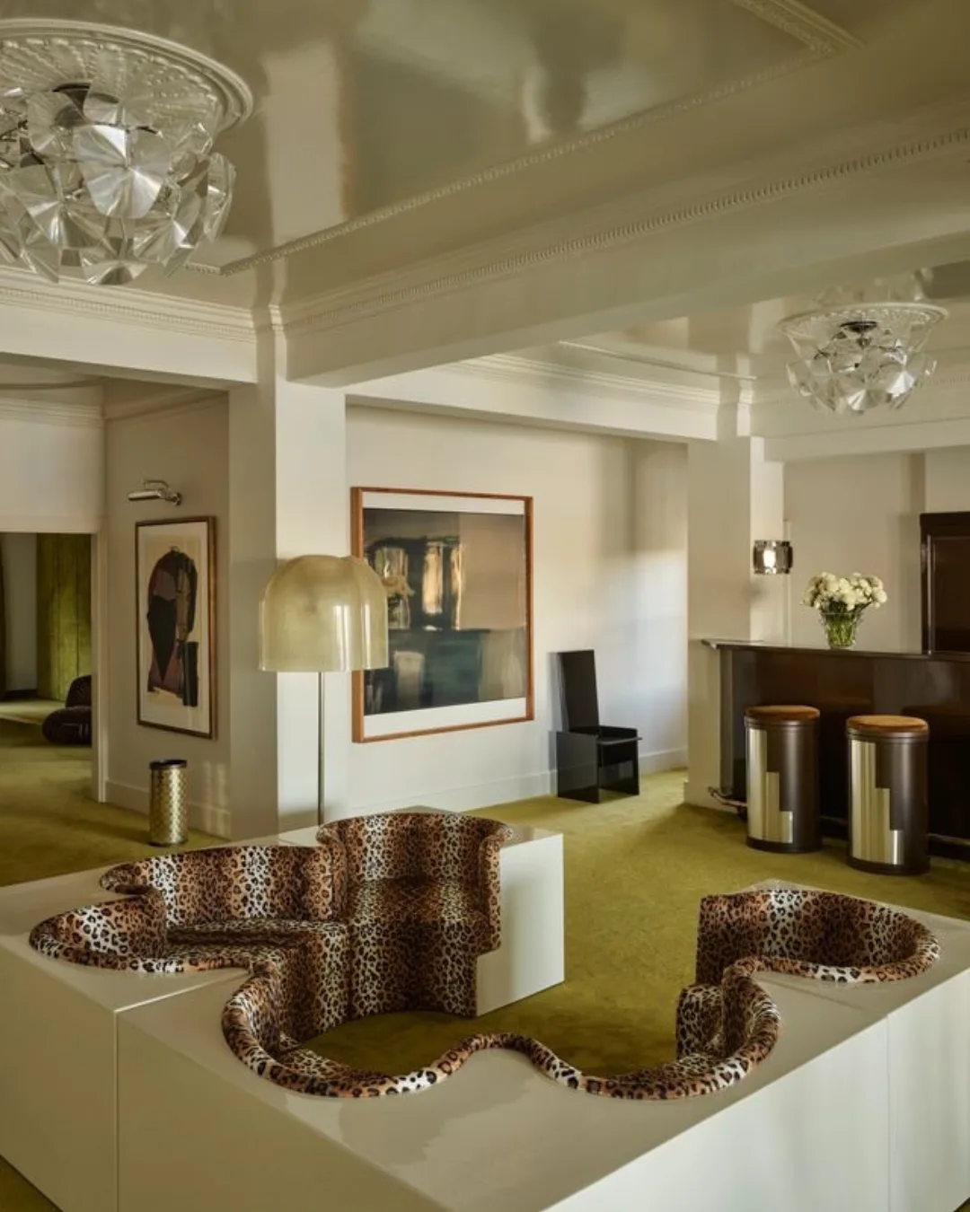 A retro lounge room with green carpet