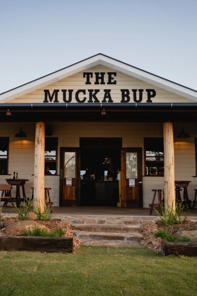 The exterior of Mucka Pub with a sign reading 'The Mucka Bup'
