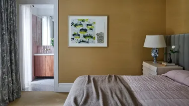 Nobilis sisal wallpaper in Sand, Redelman Fabrics. ‘Lap’ nightstand, Blu Dot. Delft ceramic table lamp, The Vault Sydney. Custom bedhead, H&J Furniture. Artwork by unknown artist. Curtains in Schumacher ‘Le Castellet’ fabric from Grant Dorman Textiles, by Coco’s Soft Furnishin