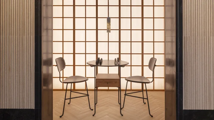 Two chairs facing a table with a chess board in a Japandi-style room at Milan Design Week 2026