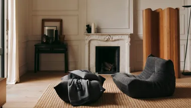 A Togo by Boss sitting in an Art Deco Living room with fireplace