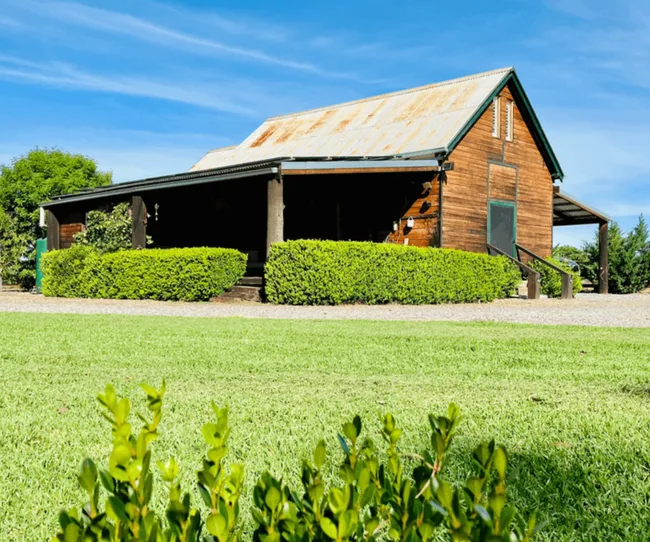 The timber facade of a converted church home in Young