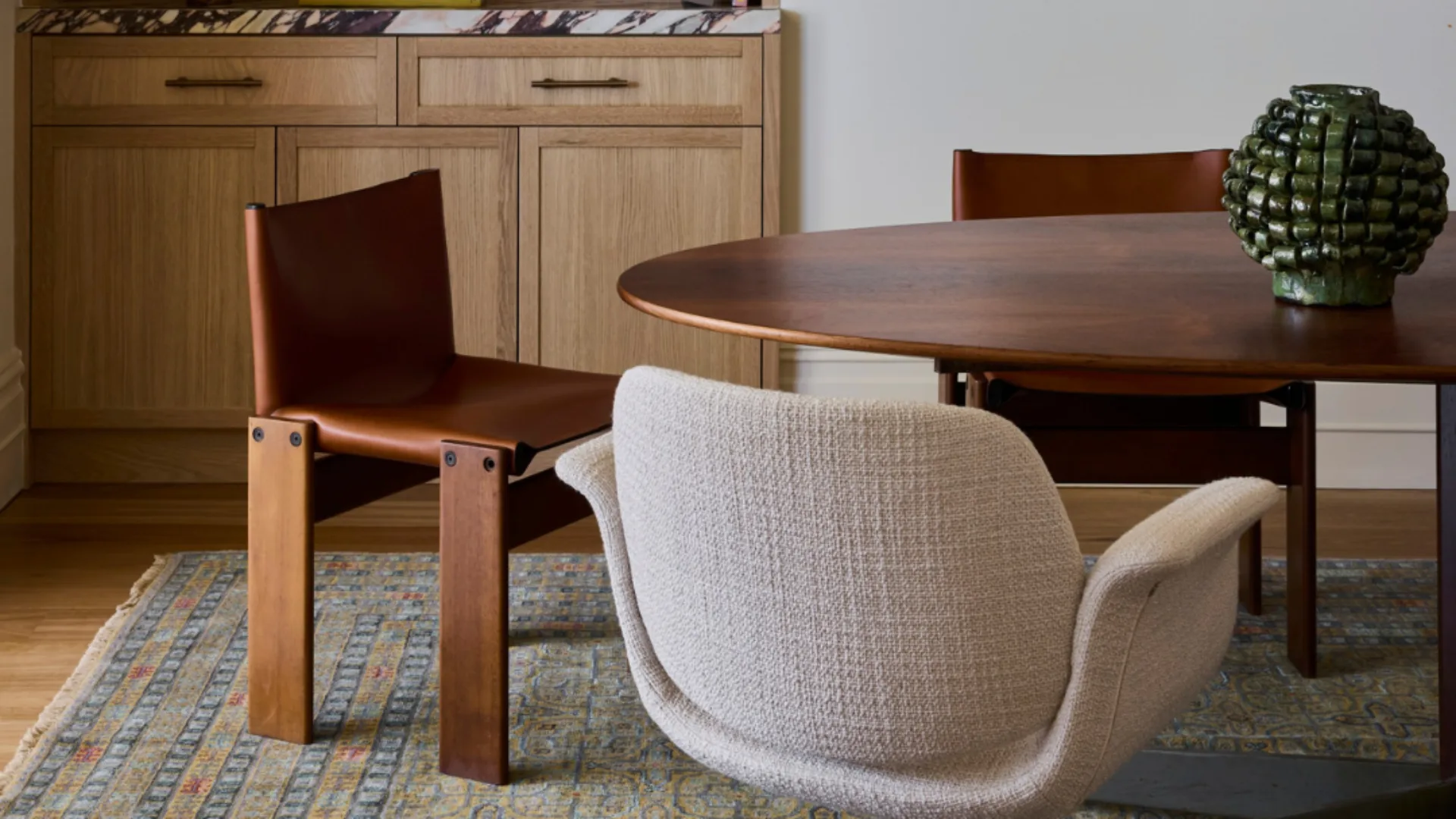 a dining table and chairs in a dining room