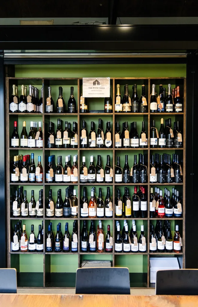 Shelves of wine at The Farm Shed, Bicheno