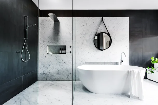 Black and white marble bathroom with freestanding bath