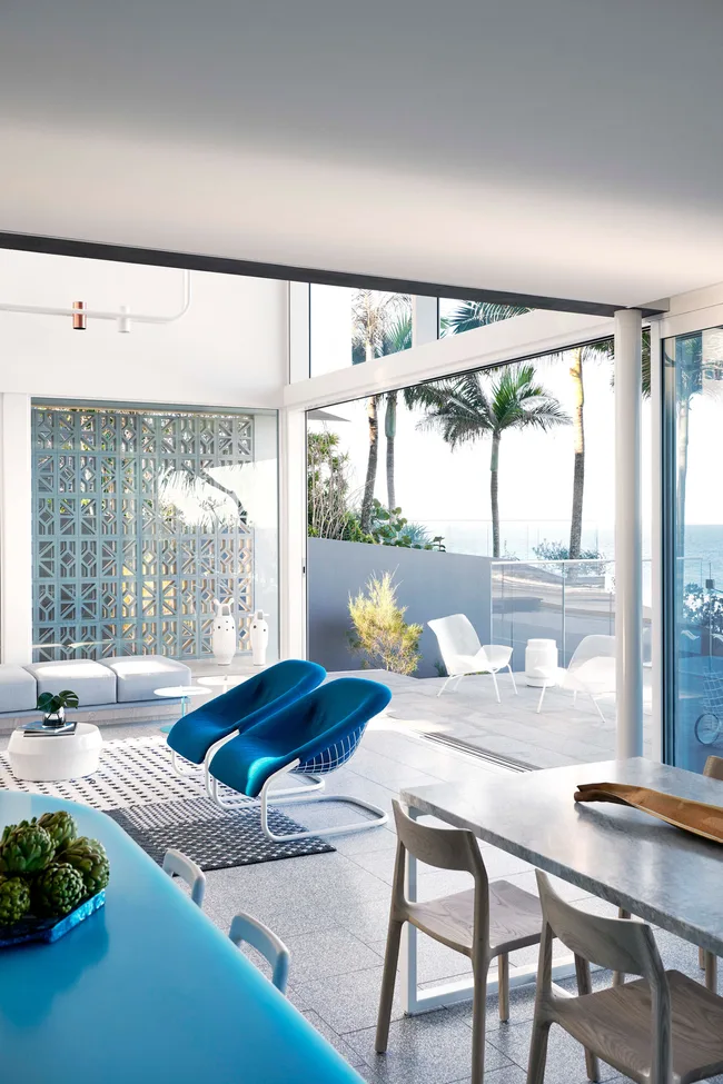 A modernist living area with blue furnishings