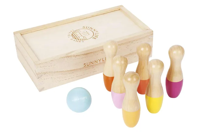 Wooden toy bowling set with colorful pins and a light blue ball, beside a Sunnylife branded box.
